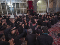 Iranian mourners are beating themselves while participating in a religious festival to commemorate Tasoua, a day ahead of Ashura, at a mosqu...