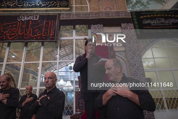 Iranian mourners are beating themselves while participating in a religious festival to commemorate Tasoua, a day ahead of Ashura, at a mosqu...