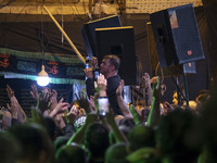 An Iranian man is singing a religious song while mourners are beating themselves during a religious festival to commemorate Tasoua, a day ah...