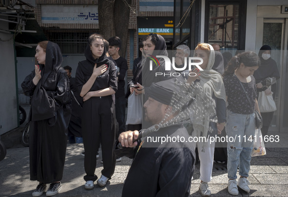 An Iranian mourner is beating himself with a chain during a religious festival to commemorate Tasoua, a day ahead of Ashura, in the Grand Ba...