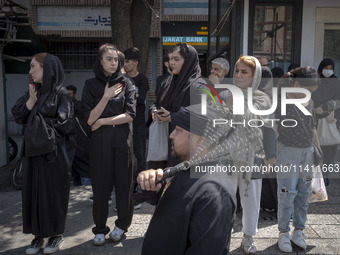 An Iranian mourner is beating himself with a chain during a religious festival to commemorate Tasoua, a day ahead of Ashura, in the Grand Ba...