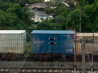 A goods train is carrying Adani Group containers and is moving towards a railyard in Kolkata, India, on July 15, 2024. (