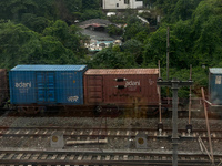 A goods train is carrying Adani Group containers and is moving towards a railyard in Kolkata, India, on July 15, 2024. (