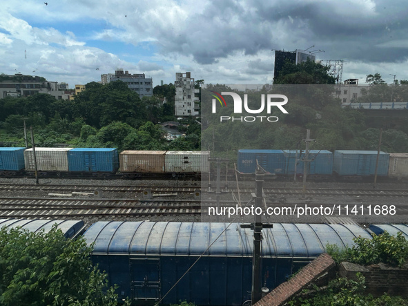 A goods train is carrying Adani Group containers and is moving towards a railyard in Kolkata, India, on July 15, 2024. 