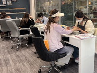 A manicurist is polishing and shaping the fingernails of a customer in Markham, Ontario, Canada, on June 08, 2024. (