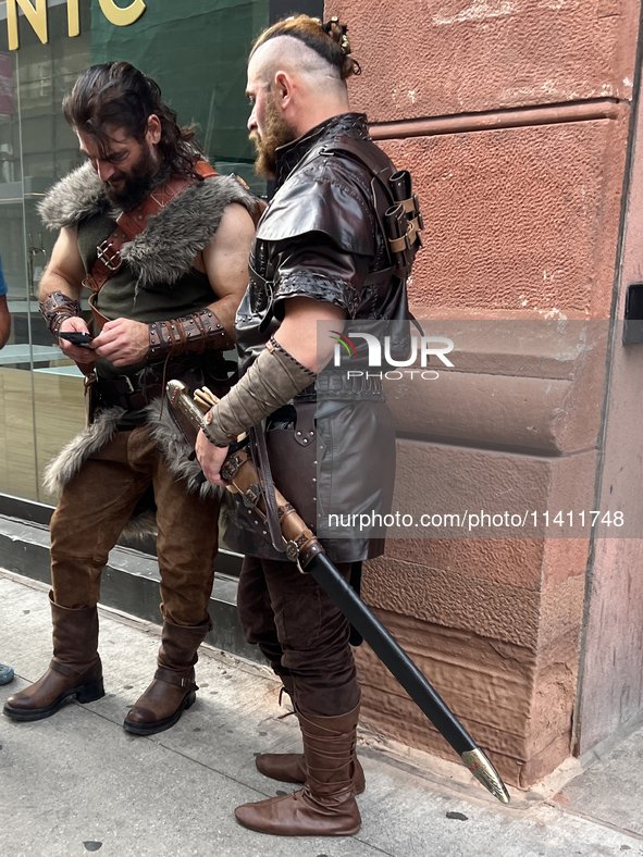 Men are dressing in Viking-style outfits in downtown, Toronto, Ontario, Canada, on July 13, 2024. 