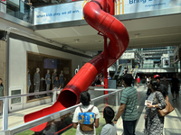 A person is sliding in the Toronto Eaton Centre in Toronto, Ontario, Canada, on July, 13, 2024. (