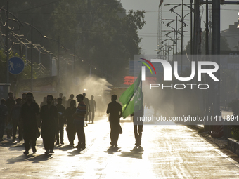 Kashmiri Shia Muslims are carrying a flag during a procession on the 8th of Muharram in Srinagar, Indian Administered Kashmir, on July 15, 2...