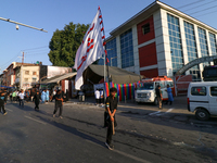 Kashmiri Shia Muslims are carrying a flag during a procession on the 8th of Muharram in Srinagar, Indian Administered Kashmir, on July 15, 2...