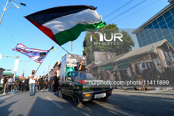 Kashmiri Shia Muslims are waving the Palestinian flag during a procession on the 8th of Muharram in Srinagar, Indian Administered Kashmir, o...