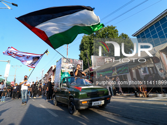 Kashmiri Shia Muslims are waving the Palestinian flag during a procession on the 8th of Muharram in Srinagar, Indian Administered Kashmir, o...