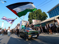 Kashmiri Shia Muslims are waving the Palestinian flag during a procession on the 8th of Muharram in Srinagar, Indian Administered Kashmir, o...