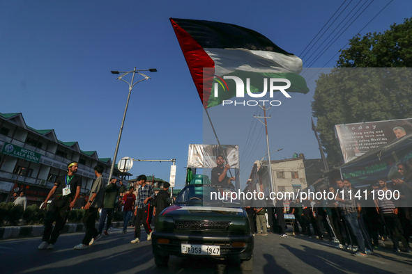 Kashmiri Shia Muslims are waving the Palestinian flag during a procession on the 8th of Muharram in Srinagar, Indian Administered Kashmir, o...