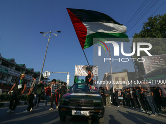 Kashmiri Shia Muslims are waving the Palestinian flag during a procession on the 8th of Muharram in Srinagar, Indian Administered Kashmir, o...