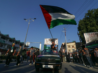 Kashmiri Shia Muslims are waving the Palestinian flag during a procession on the 8th of Muharram in Srinagar, Indian Administered Kashmir, o...