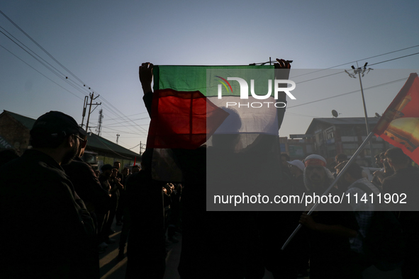 Kashmiri Shia Muslims are waving the Palestinian flag during a procession on the 8th of Muharram in Srinagar, Indian Administered Kashmir, o...