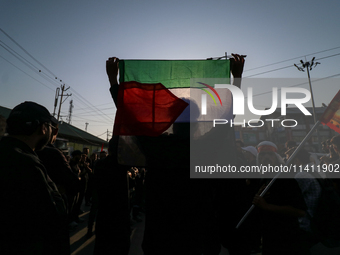 Kashmiri Shia Muslims are waving the Palestinian flag during a procession on the 8th of Muharram in Srinagar, Indian Administered Kashmir, o...