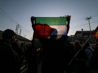 Kashmiri Shia Muslims are waving the Palestinian flag during a procession on the 8th of Muharram in Srinagar, Indian Administered Kashmir, o...