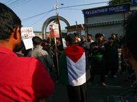 A Kashmiri Shia Muslim man is displaying a Palestinian flag during a procession on the 8th of Muharram in Srinagar, Indian Administered Kash...