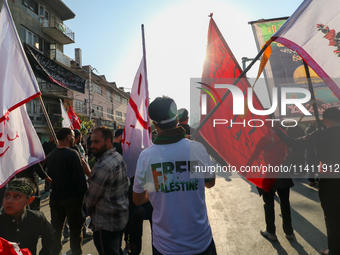 Kashmiri Shia Muslims are displaying flags during a procession on the 8th of Muharram in Srinagar, Indian Administered Kashmir, on July 15,...