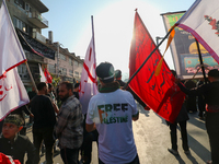 Kashmiri Shia Muslims are displaying flags during a procession on the 8th of Muharram in Srinagar, Indian Administered Kashmir, on July 15,...