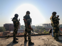 Indian paramilitary troopers are standing alert during a procession on the 8th of Muharram in Srinagar, Indian Administered Kashmir, on July...