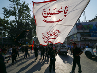 Kashmiri Shia Muslims are displaying flags during a procession on the 8th of Muharram in Srinagar, Indian Administered Kashmir, on July 15,...