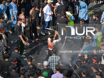 A Kashmiri Shia Muslim is flagellating himself during a procession on the 8th of Muharram in Srinagar, Indian Administered Kashmir, on July...