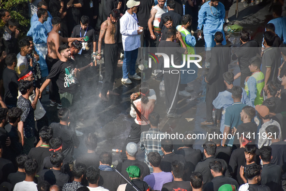 A Kashmiri Shia Muslim is flagellating himself during a procession on the 8th of Muharram in Srinagar, Indian Administered Kashmir, on July...