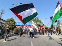 Kashmiri Shia Muslims are displaying Palestinian flags during a procession on the 8th of Muharram in Srinagar, Indian Administered Kashmir,...