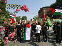 Kashmiri Shia Muslims are displaying Palestinian flags during a procession on the 8th of Muharram in Srinagar, Indian Administered Kashmir,...