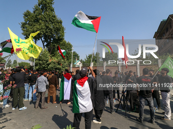 Kashmiri Shia Muslims are displaying Palestinian flags during a procession on the 8th of Muharram in Srinagar, Indian Administered Kashmir,...