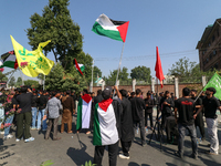 Kashmiri Shia Muslims are displaying Palestinian flags during a procession on the 8th of Muharram in Srinagar, Indian Administered Kashmir,...