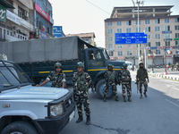 Indian paramilitary troopers are standing alert during a procession on the 8th of Muharram in Srinagar, Indian Administered Kashmir, on July...