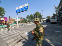 Indian paramilitary troopers are standing alert during a procession on the 8th of Muharram in Srinagar, Indian Administered Kashmir, on July...