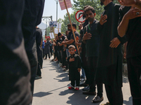 Kashmiri Shia Muslims are taking part in a Muharram procession on the 8th of Muharram in Srinagar, Indian Administered Kashmir, on July 15,...