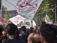 Kashmiri Shia Muslims are displaying flags during a procession on the 8th of Muharram in Srinagar, Indian Administered Kashmir, on July 15,...