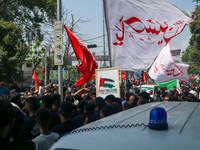 Kashmiri Shia Muslims are displaying flags during a procession on the 8th of Muharram in Srinagar, Indian Administered Kashmir, on July 15,...