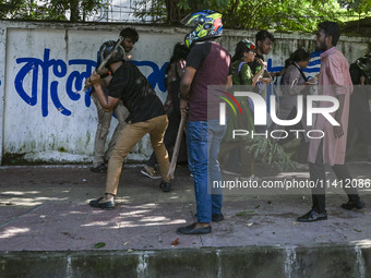 Anti-quota protesters and students backing the ruling Awami League party are clashing on Dhaka University campus in Dhaka, Bangladesh, on Ju...