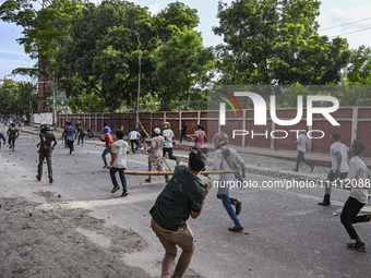 Anti-quota protesters and students backing the ruling Awami League party are clashing on Dhaka University campus in Dhaka, Bangladesh, on Ju...