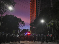 Bangladesh riot police are taking a position in front of Shahidullah Hall during clashes between anti-quota protesters and students backing...