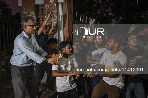 Anti-quota protesters and students are shouting in front of Shahidullah Hall, during clashes between anti-quota protesters and students back...