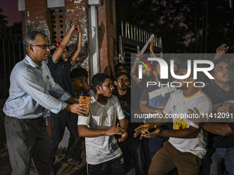 Anti-quota protesters and students are shouting in front of Shahidullah Hall, during clashes between anti-quota protesters and students back...