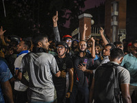 Anti-quota protesters and students are shouting in front of Shahidullah Hall, during clashes between anti-quota protesters and students back...