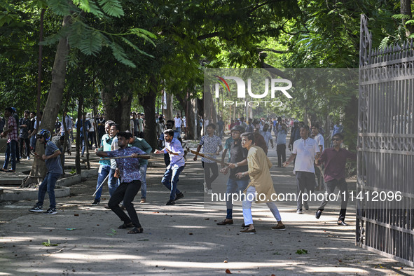 Anti-quota protesters and students backing the ruling Awami League party are clashing on Dhaka University campus in Dhaka, Bangladesh, on Ju...