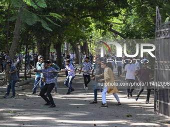 Anti-quota protesters and students backing the ruling Awami League party are clashing on Dhaka University campus in Dhaka, Bangladesh, on Ju...