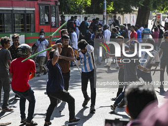 Anti-quota protesters and students backing the ruling Awami League party are clashing on Dhaka University campus in Dhaka, Bangladesh, on Ju...