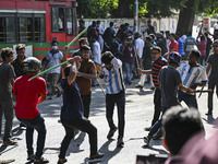 Anti-quota protesters and students backing the ruling Awami League party are clashing on Dhaka University campus in Dhaka, Bangladesh, on Ju...