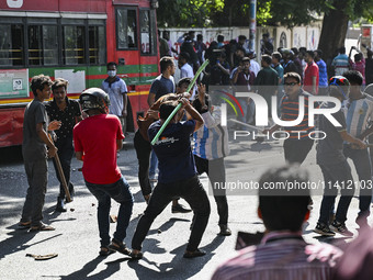 Anti-quota protesters and students backing the ruling Awami League party are clashing on Dhaka University campus in Dhaka, Bangladesh, on Ju...