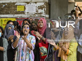 Students are shouting in front of Begum Rokeya Hall during anti-quota protests and clashes between students backing the ruling Awami League...